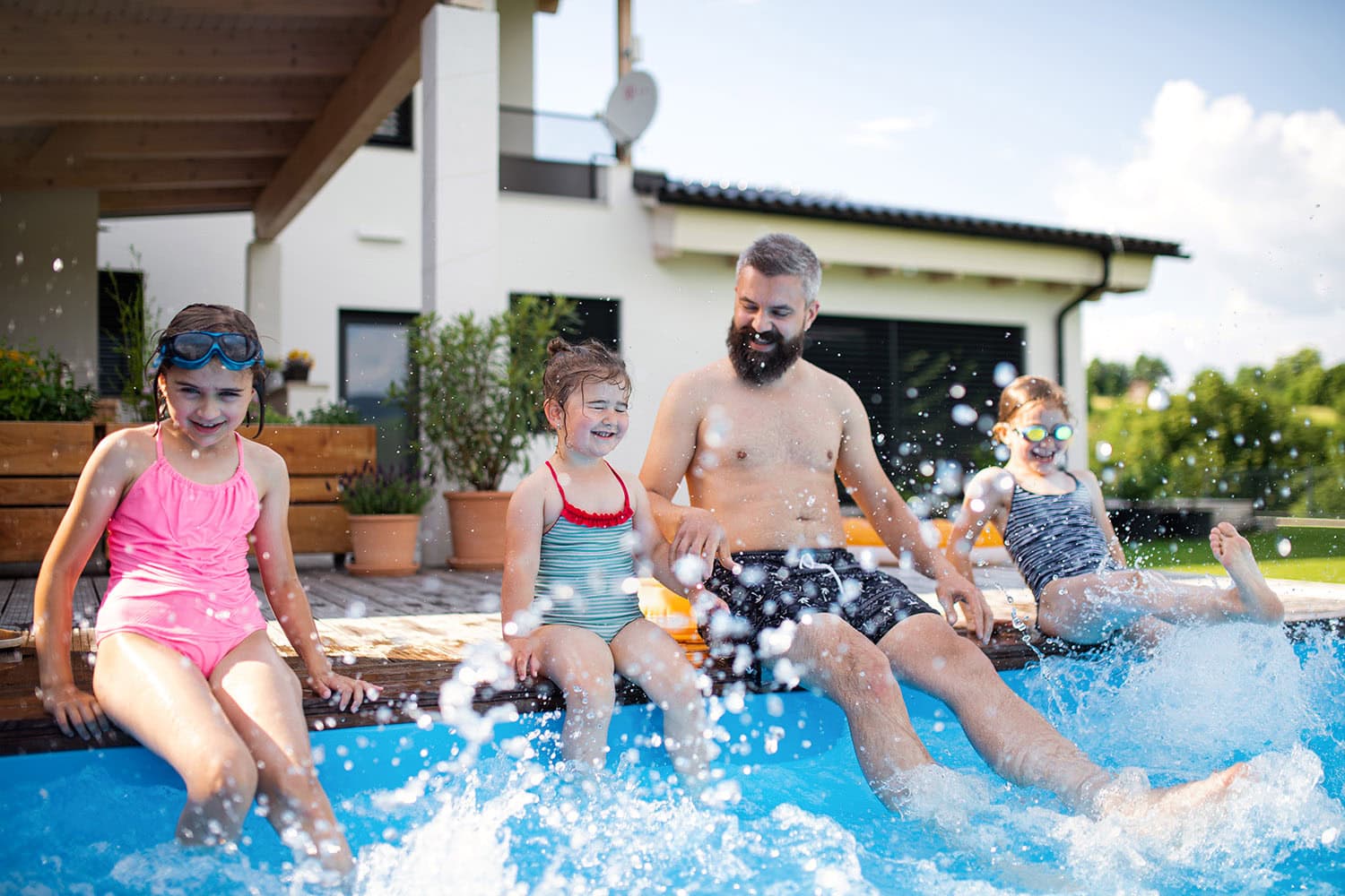 family-outside-in-their-new-swimming-pool