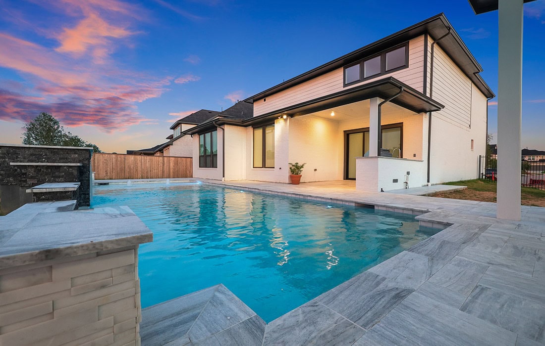 modern-home-backyard-pool-twilight-houston